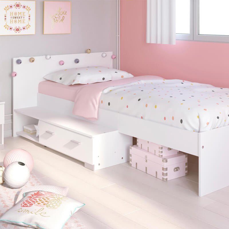 Lit enfant blanc 90x190 avec tiroir de rangement dans une chambre de fille décoration rose.